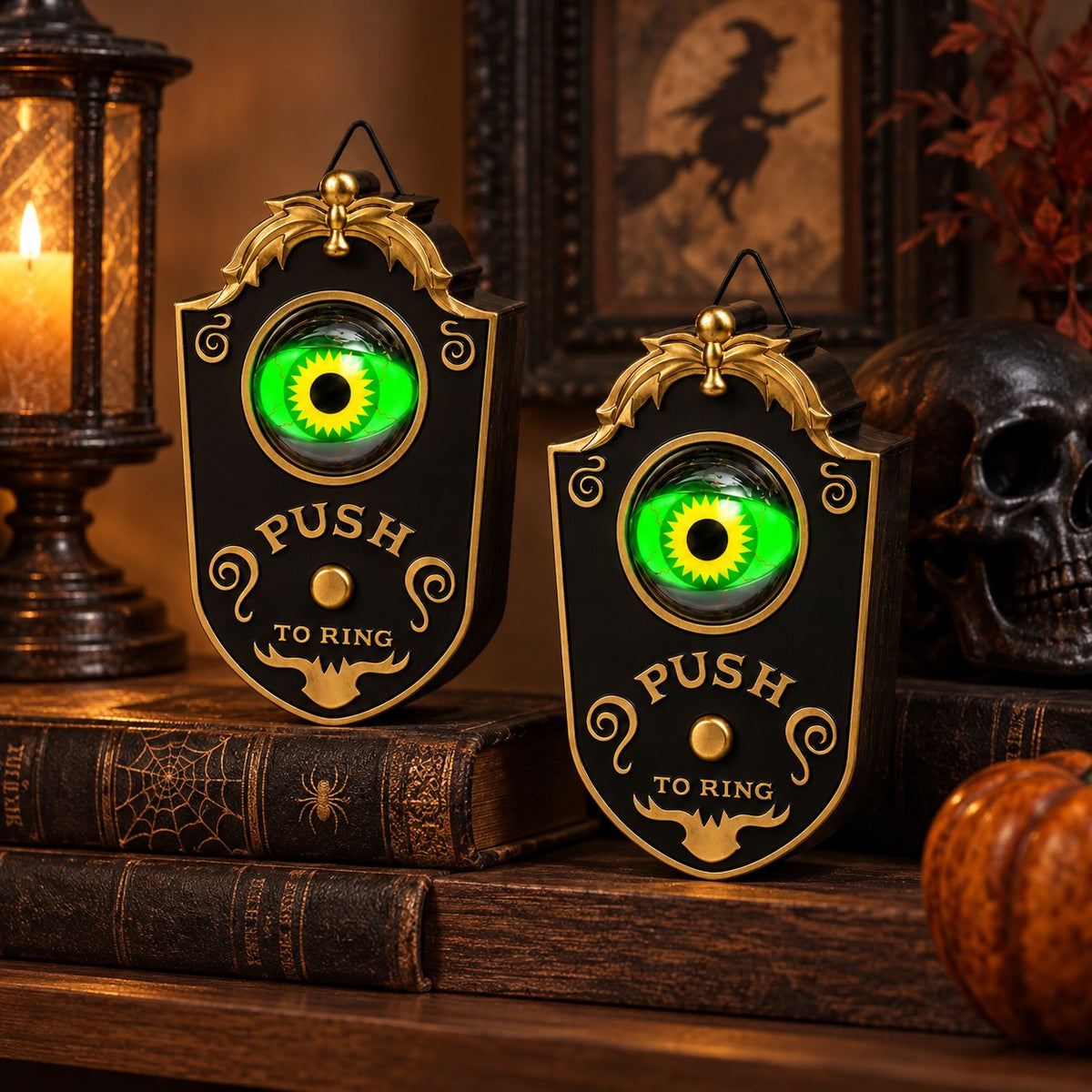 Two Ghost EYE Doorbells on a stack of old books